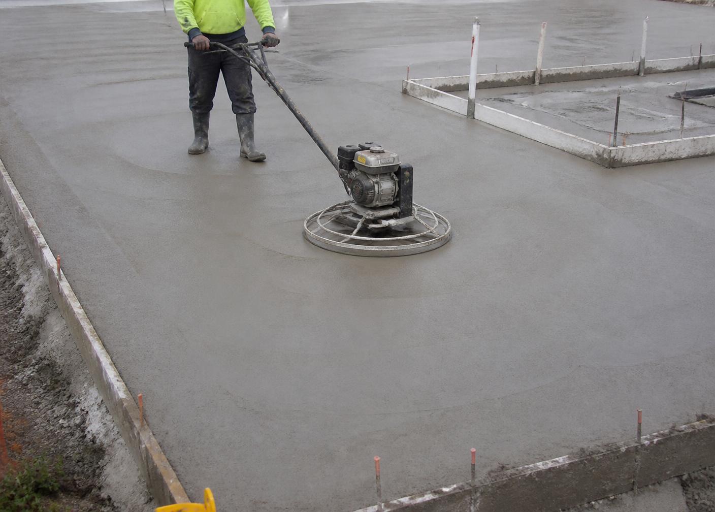 Concrete slab being finished between formwork