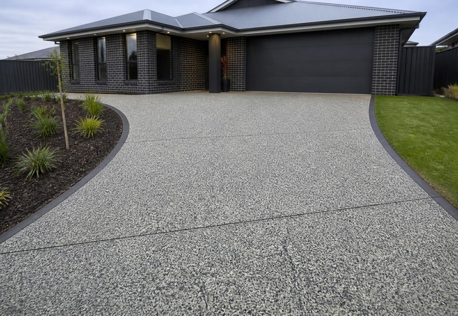 Finished exposed aggregate driveway at a completed home