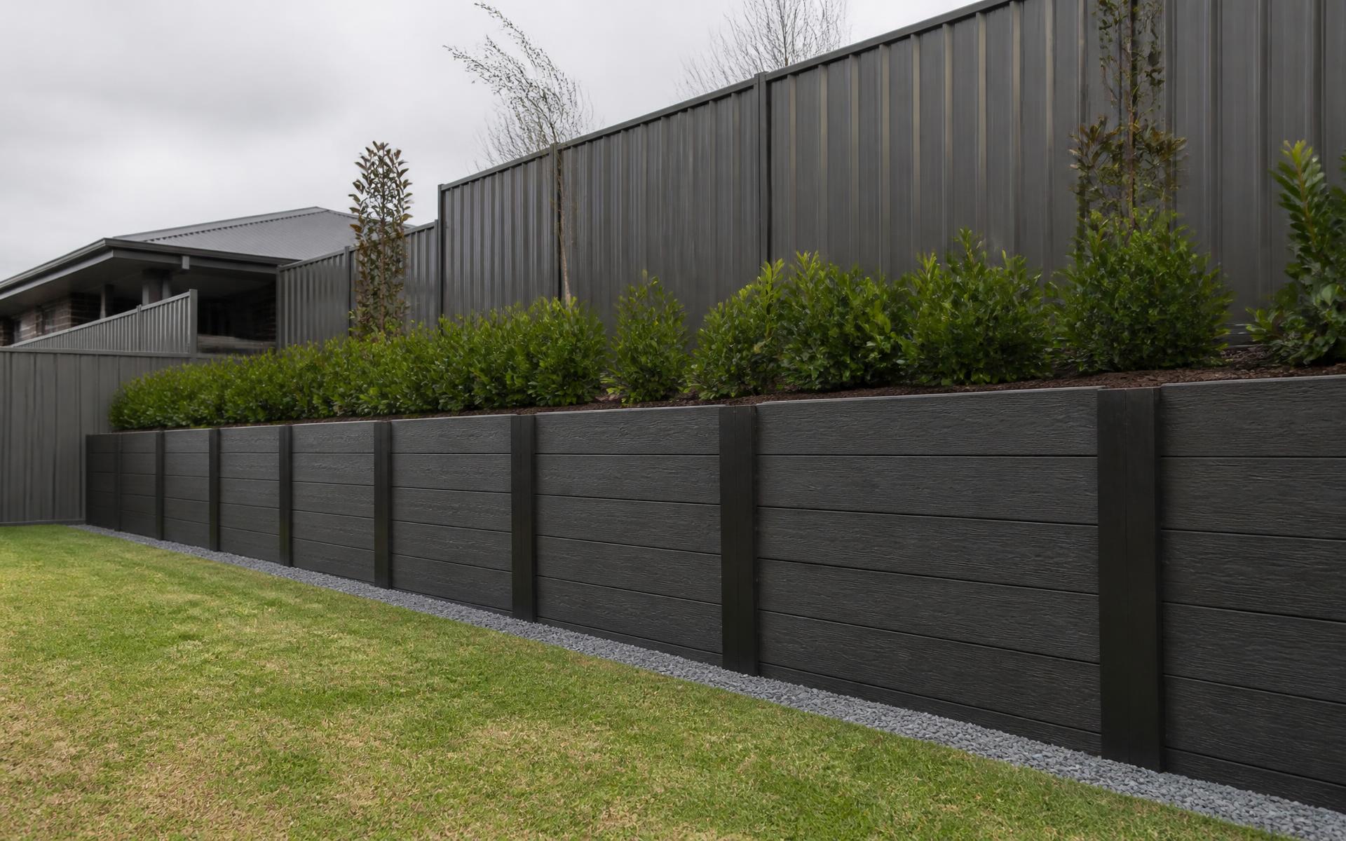 Completed concrete sleeper retaining wall and lawn on a South-East Melbourne project